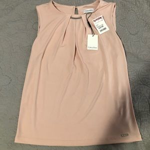 Light blush pink  blouse, was a gift never worn.